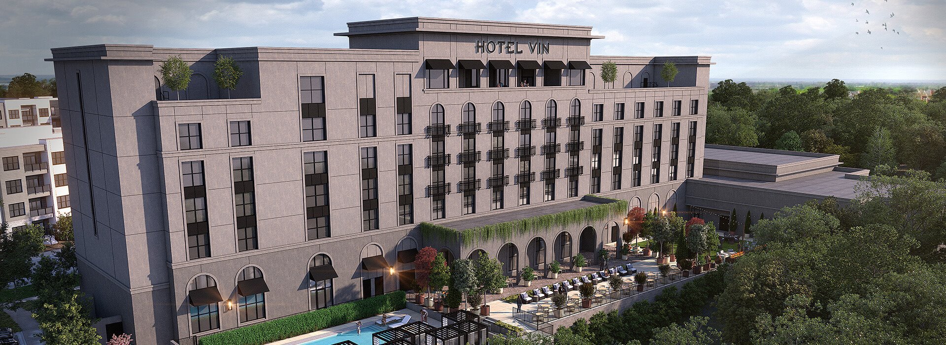 The Hotel Vin Rogers in Arkansas offers an elevated stay with a pool, and rooftop lounge near the Walmart Amp and UofA.